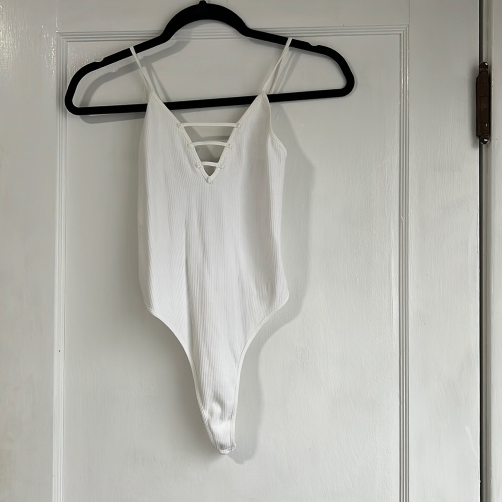 White ribbed v-neck bodysuit tank top. New with tags.
